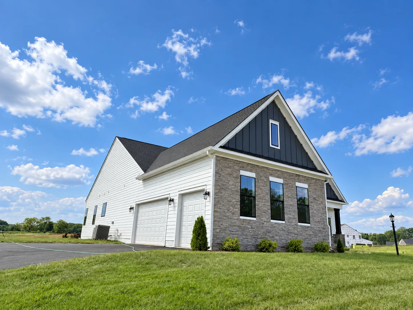 Side view of the Torrey modern farmhouse exterior at Hampstead in Stafford VA