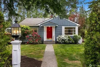 Blue house with a red front door, the home featured in the market outlook article