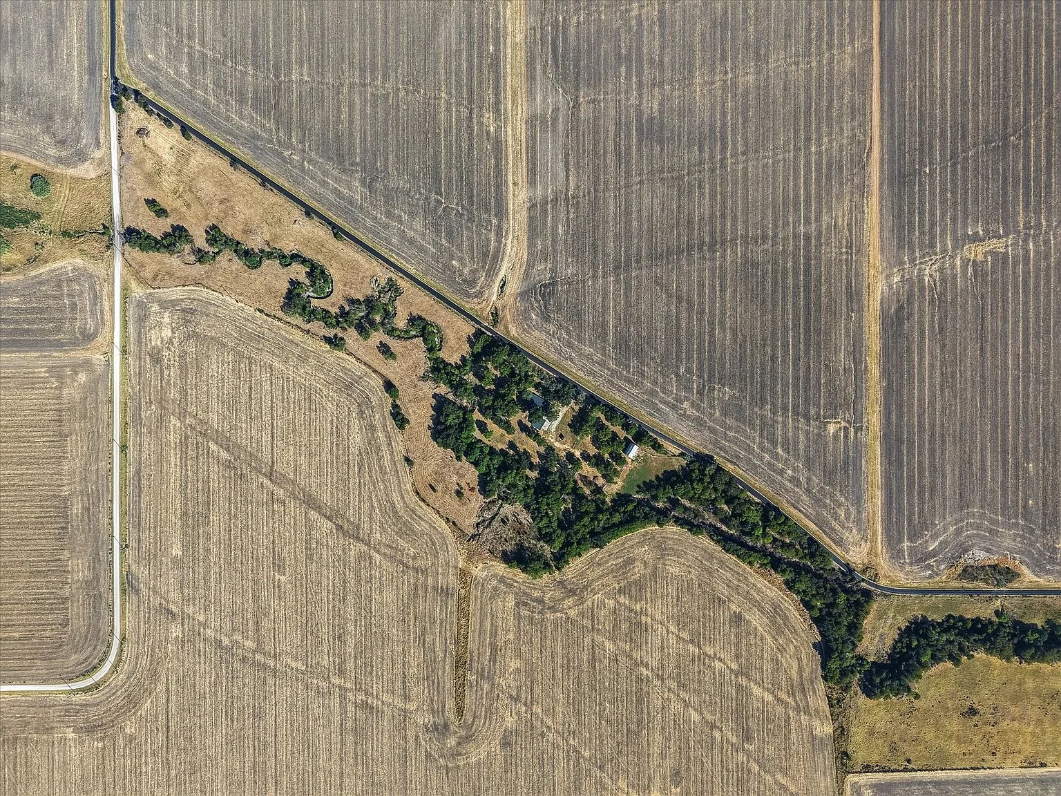Aerial view of the homestead set within pasture and farmland near Ennis