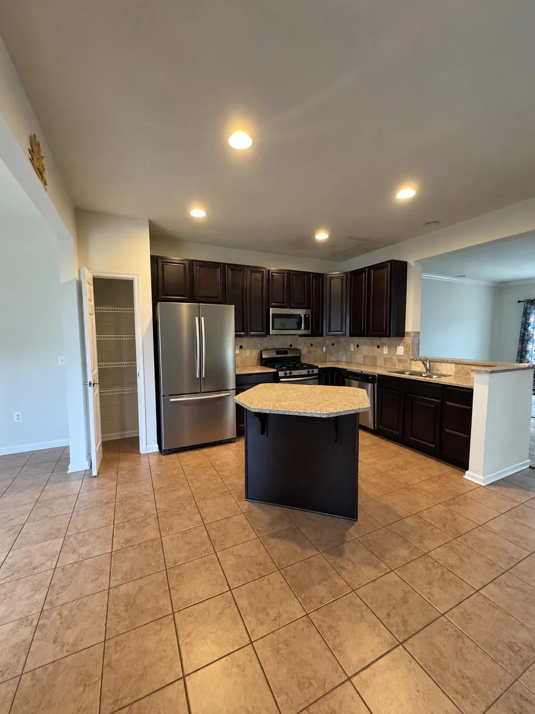 Kitchen with island and dark cabinetry at 158 Short Branch Rd in Stafford VA
