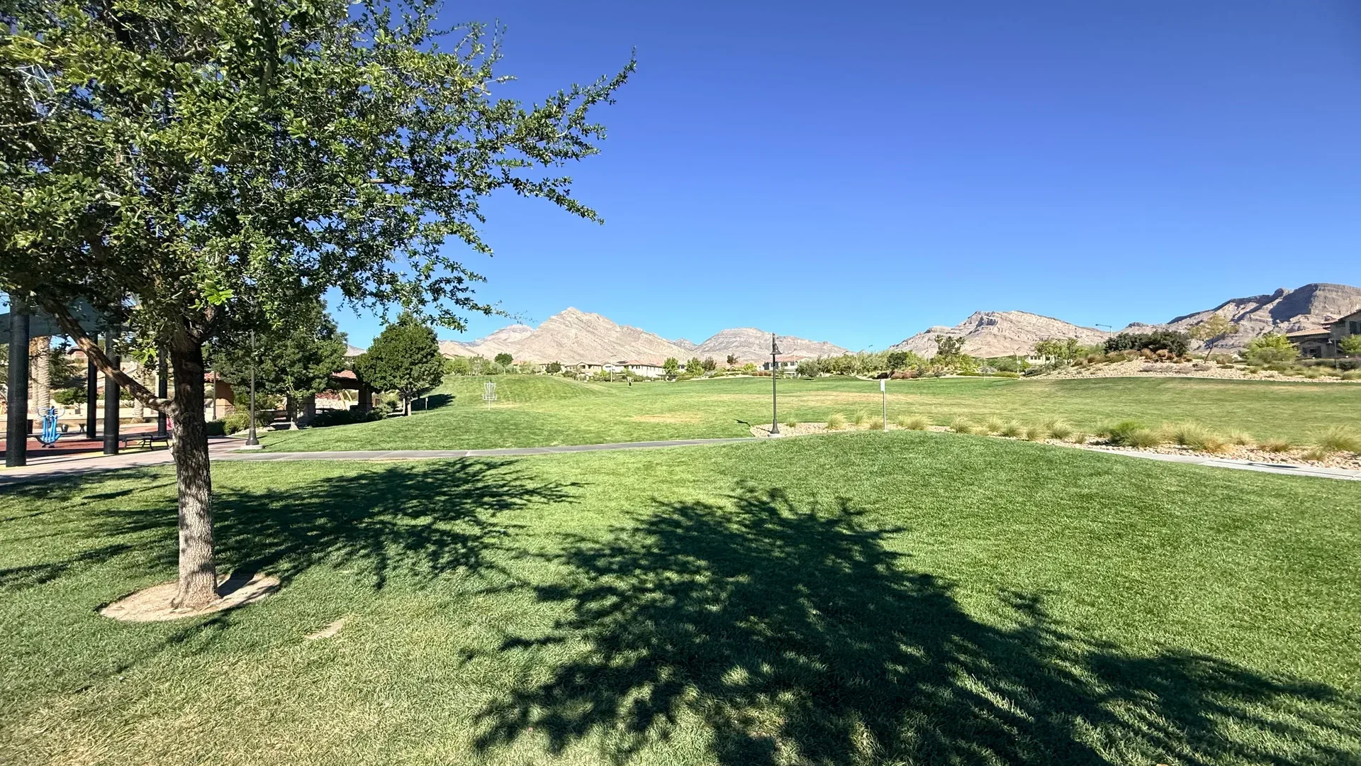 Open manicured lawn with mountain views at a Summerlin community park