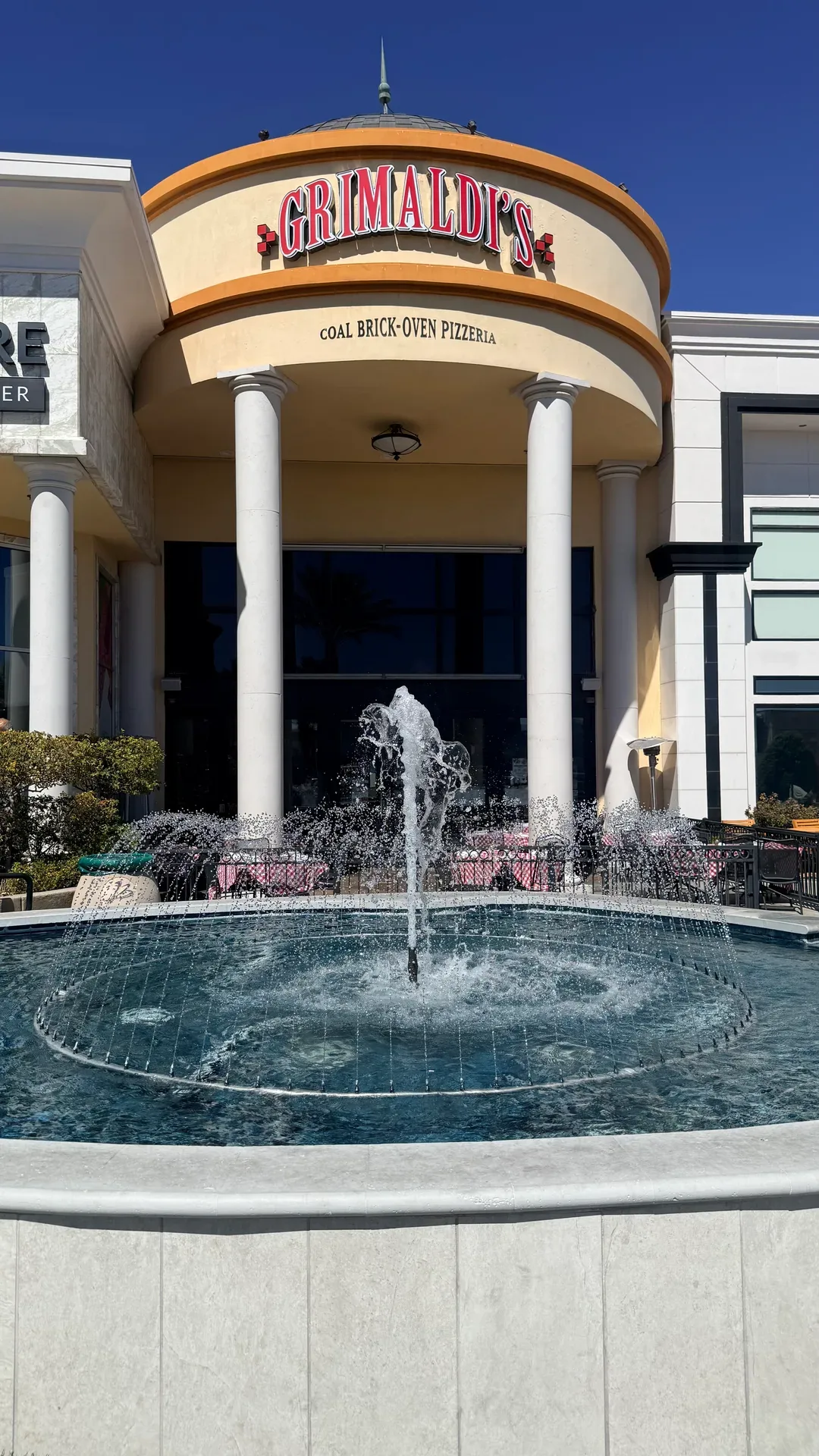 Grimaldi's Pizzeria entrance with its fountain at Boca Park