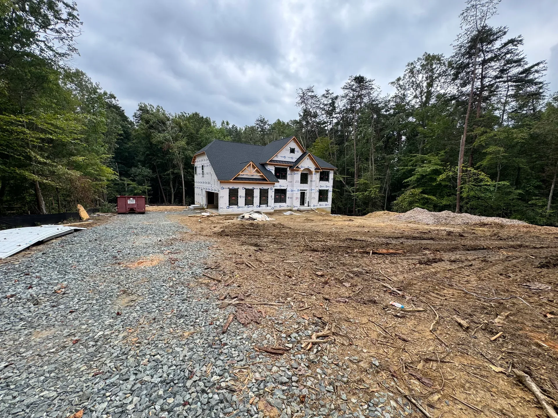 Single-family home under construction on a wooded Ruby Meadows homesite in Stafford VA
