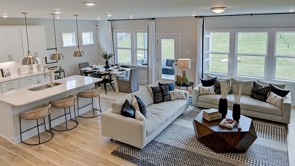 Bright, open-concept kitchen and living area in a new-construction Knightdale home