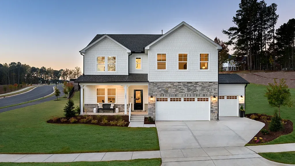 New-construction two-story home at dusk in a Knightdale community