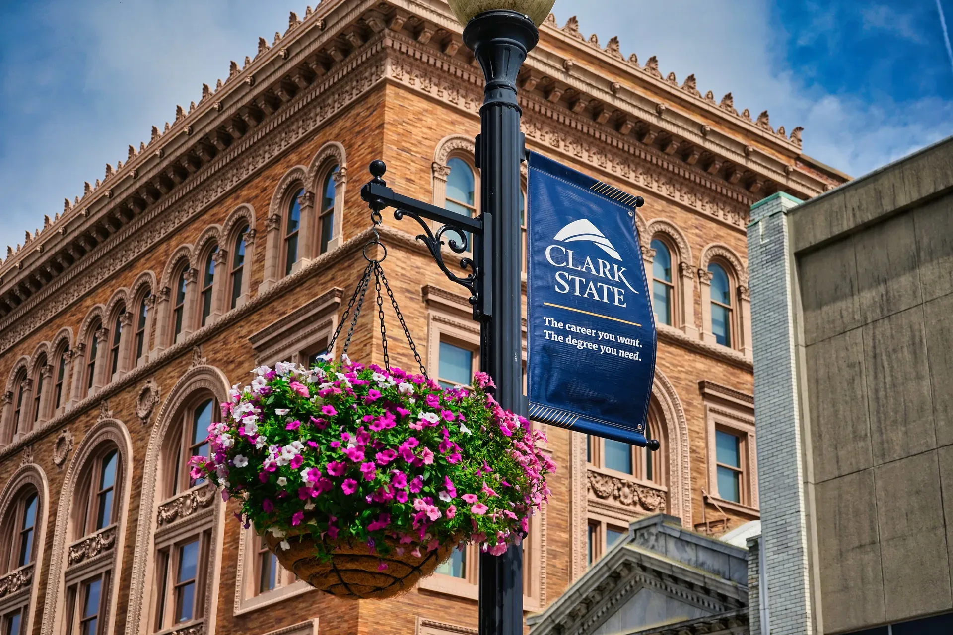 The ornate historic brick facade of a downtown Springfield Ohio building with arched windows and stone detailing