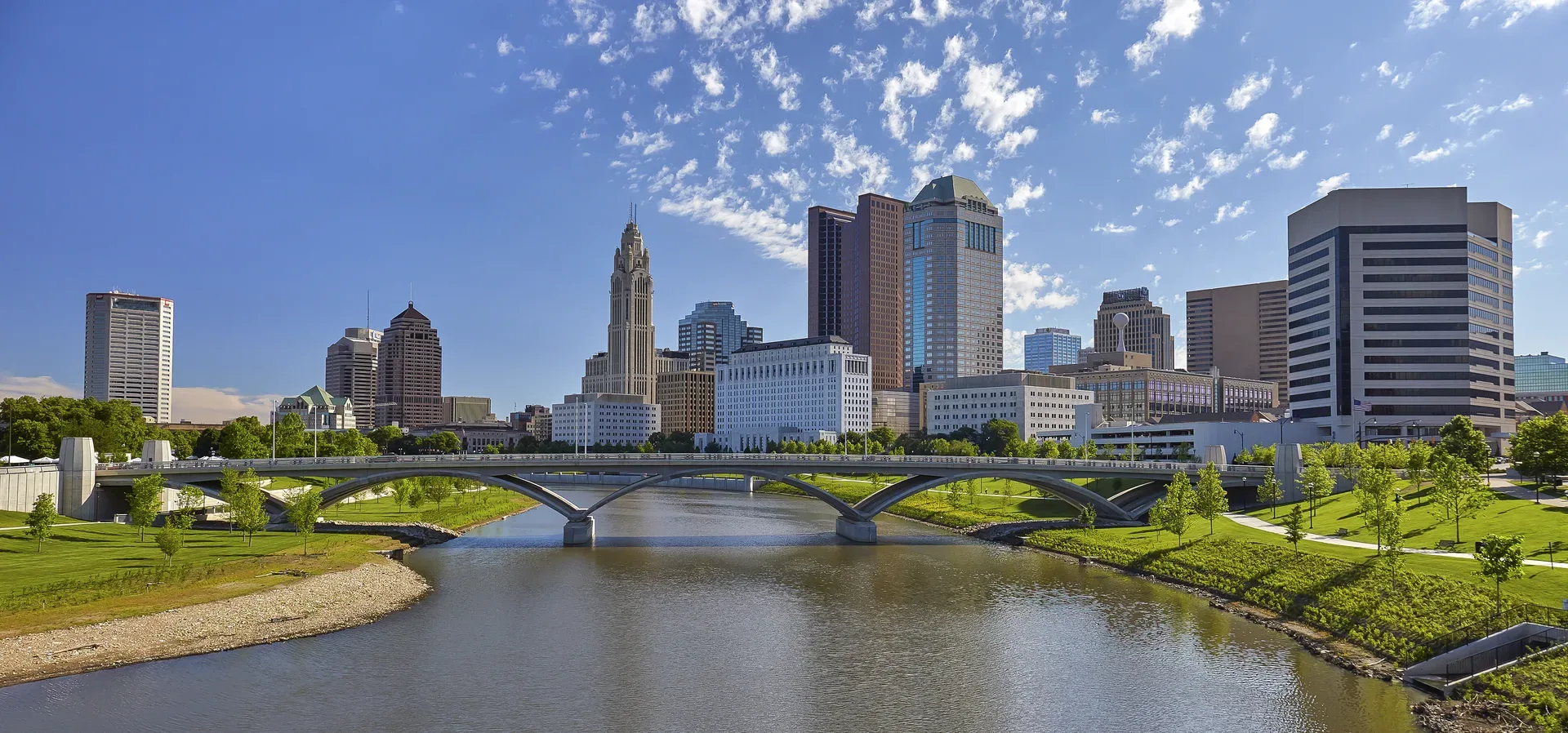 The Columbus skyline rising along the Scioto River, a Central Ohio landmark for Glasshouse Realty's Columbus and Springfield office