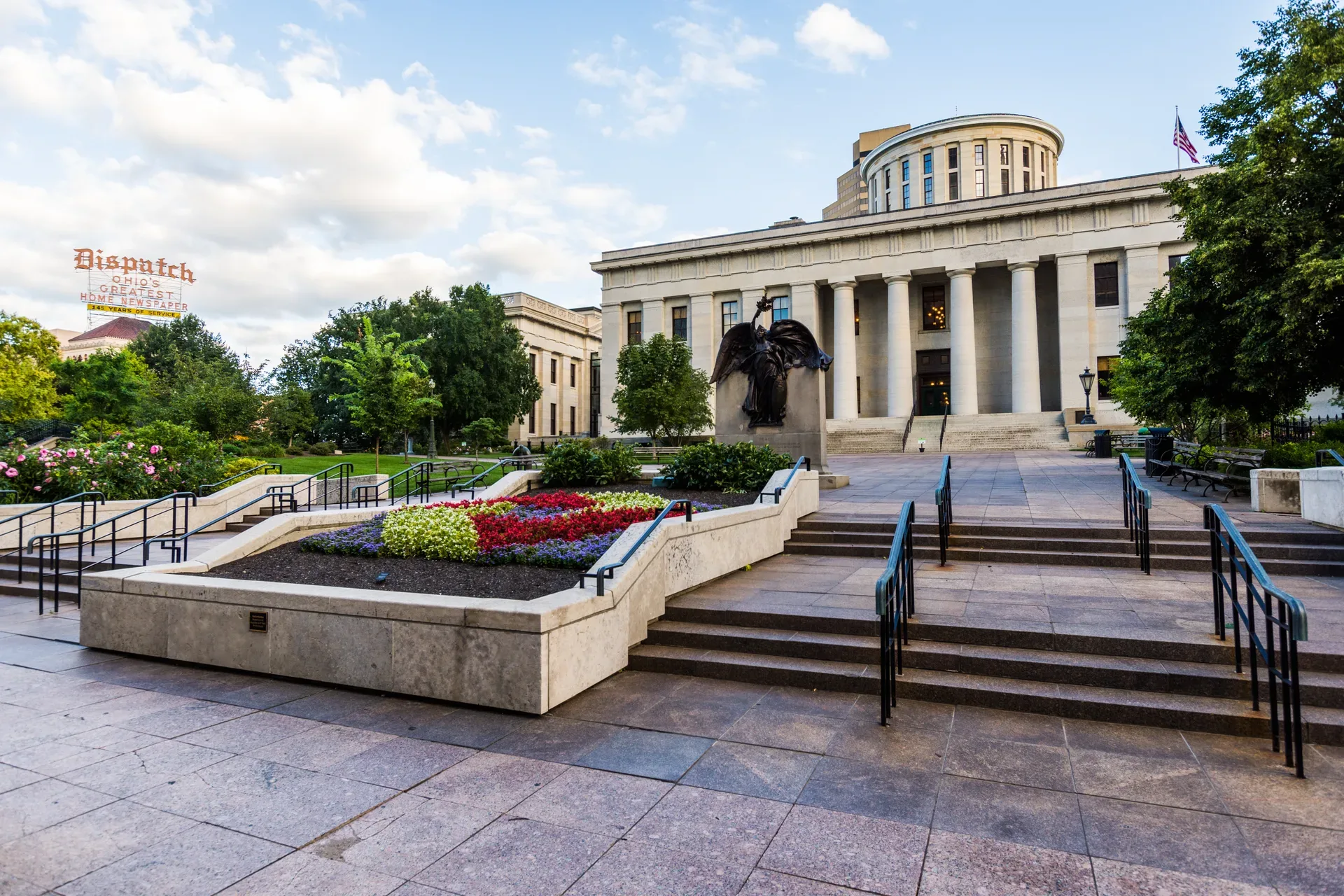 The Ohio Statehouse in downtown Columbus, a limestone neoclassical landmark with Doric columns and a central rotunda