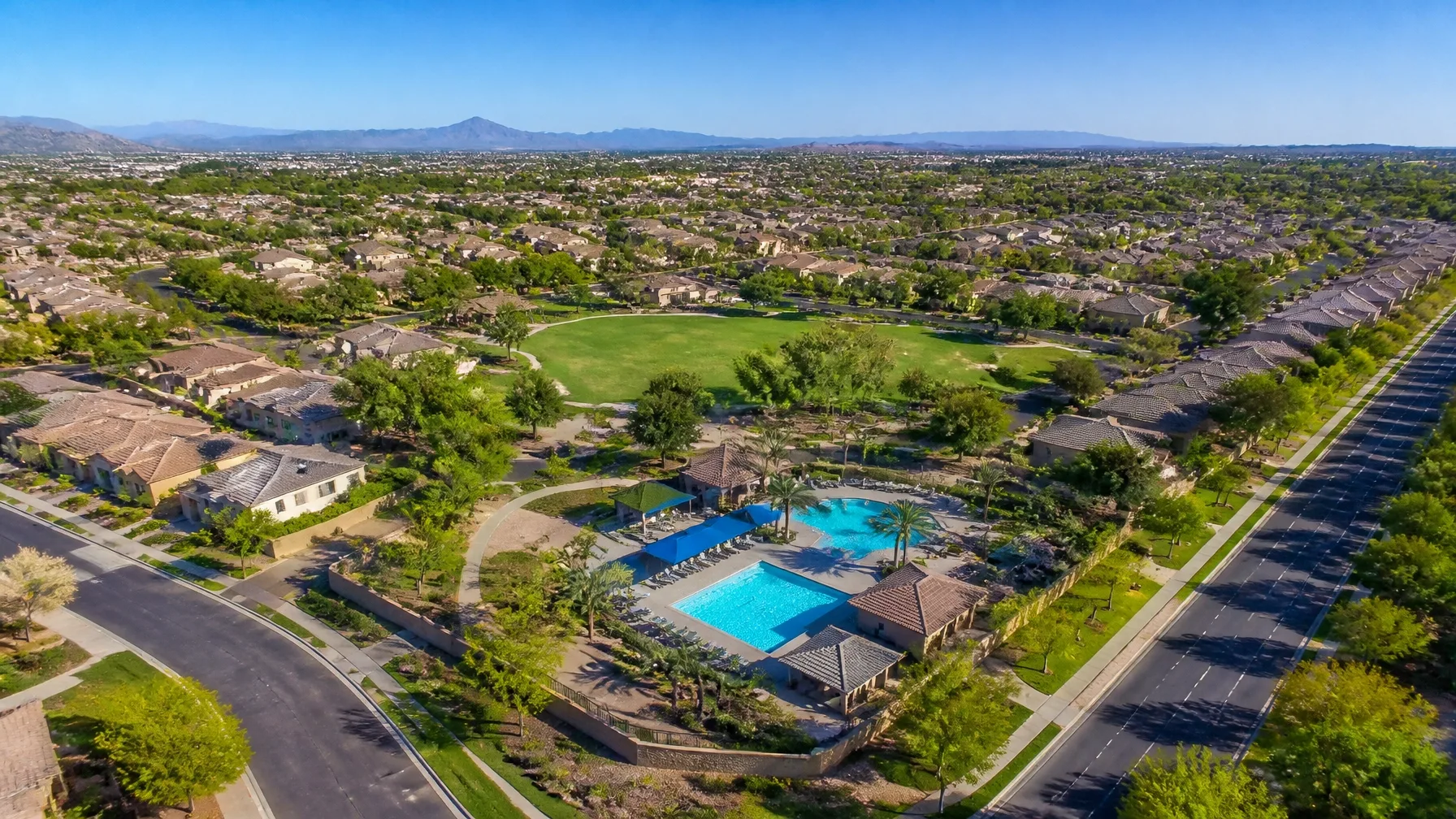 Aerial view of a community recreation center with a pool complex in a West Valley neighborhood