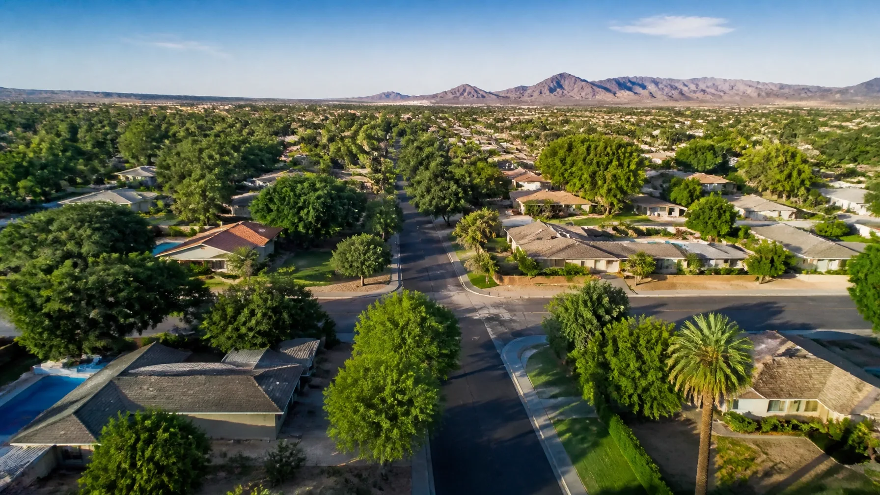 Aerial view of suburban neighborhoods with homes and pools