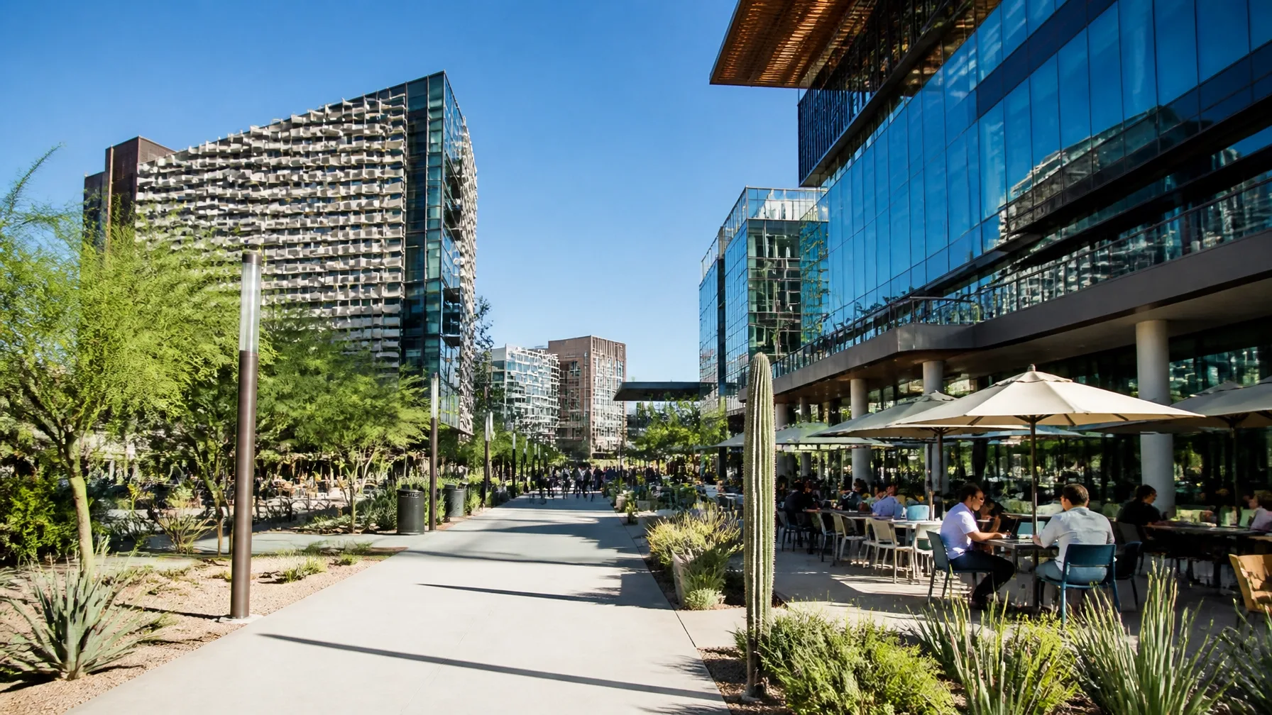 Outdoor urban plaza with modern buildings and desert landscaping