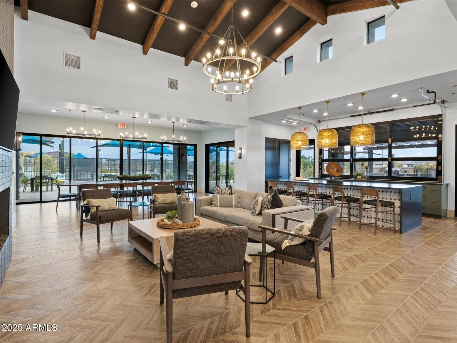 Spacious community clubhouse lounge with vaulted ceilings and seating areas