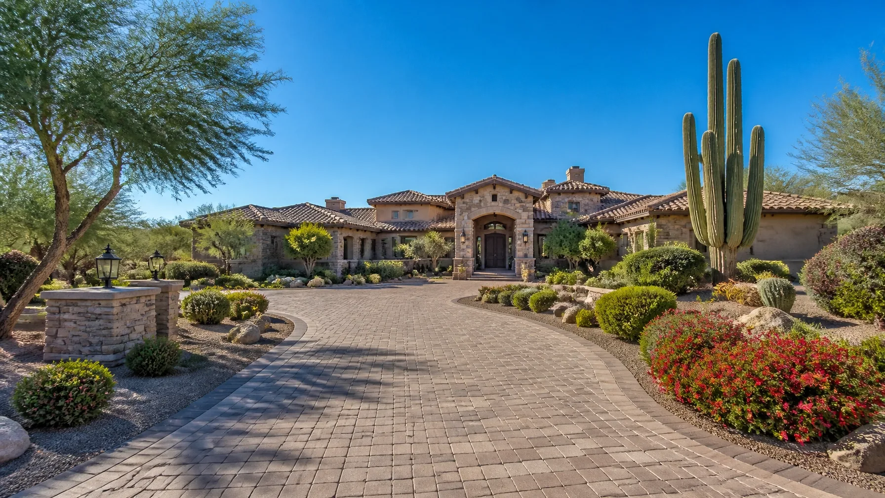 A desert contemporary Arizona home with stone and stucco exterior at golden hour
