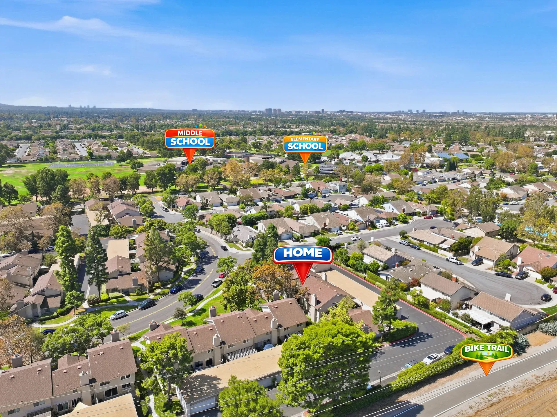 Aerial photograph of the 8 Silverwood community from above, showing the surrounding Irvine neighborhood and its tree-lined streets