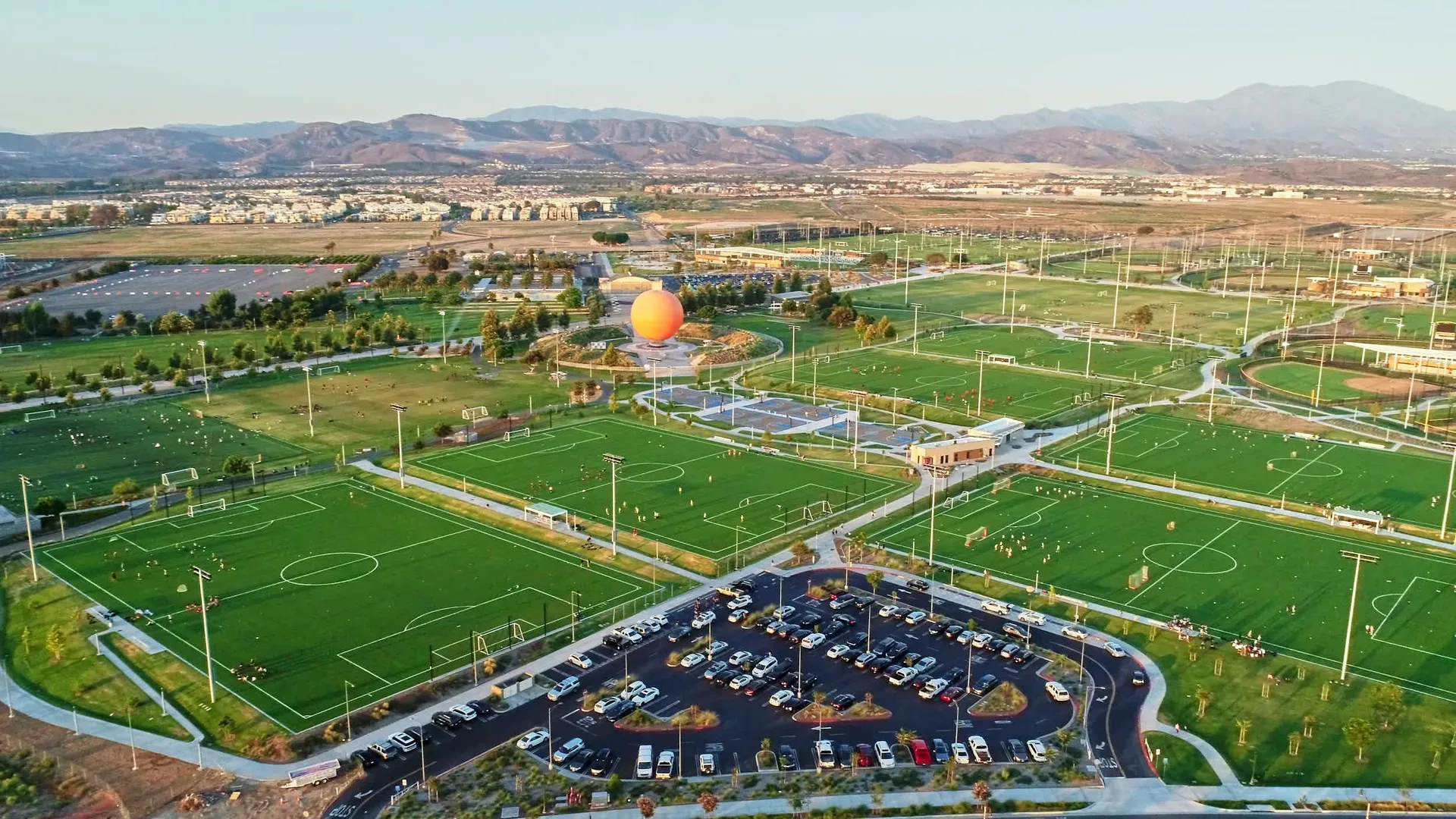 Aerial view of the Great Park in Irvine, with its sports fields, gardens, and open green space seen from above
