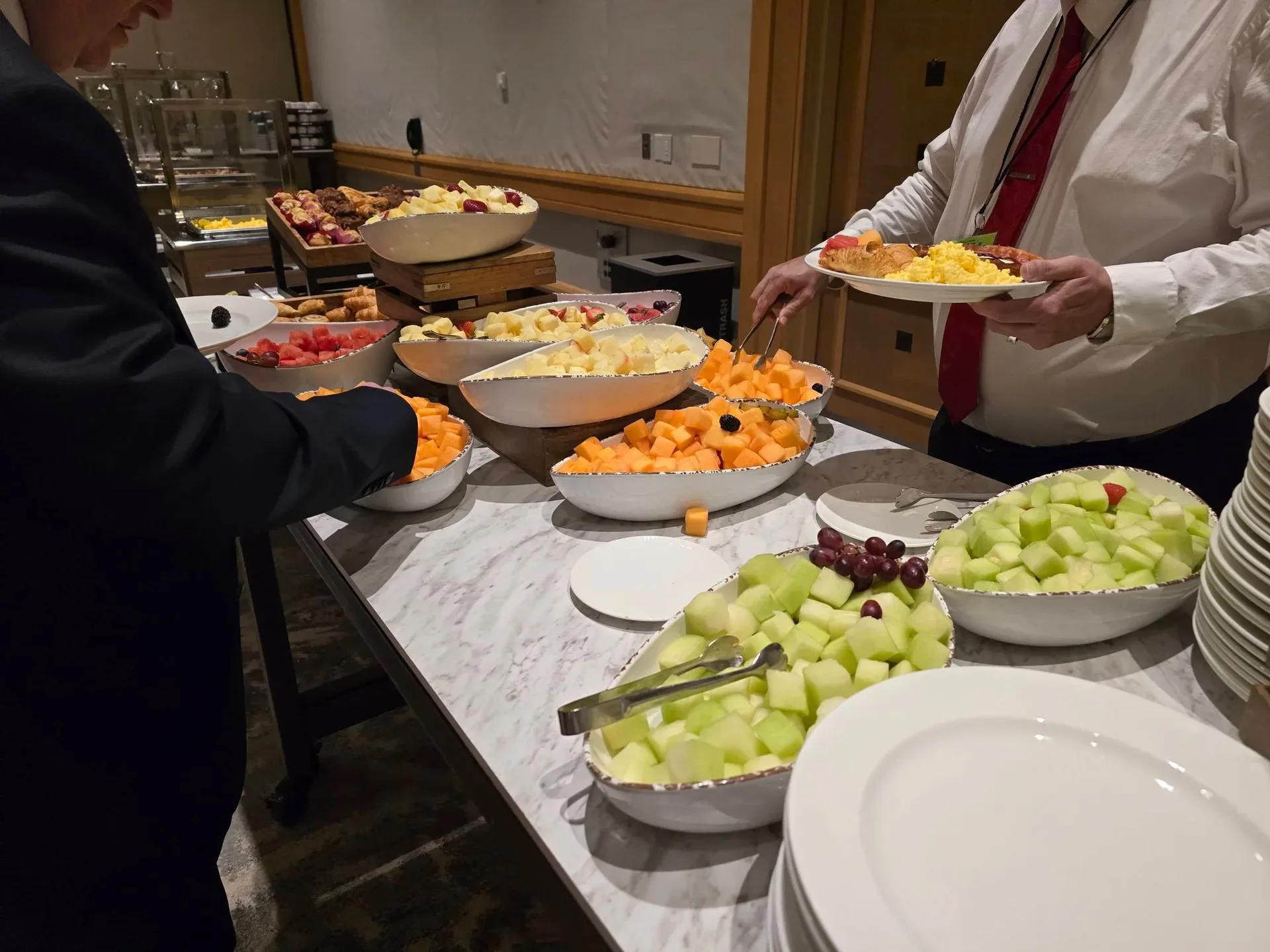 The marble-top breakfast buffet at The Diplomat Beach Resort in Hollywood, Florida, laid out with fresh fruit bowls and hot breakfast food before the Day 1 sessions of the Mike Ferry 2026 Superstar Retreat
