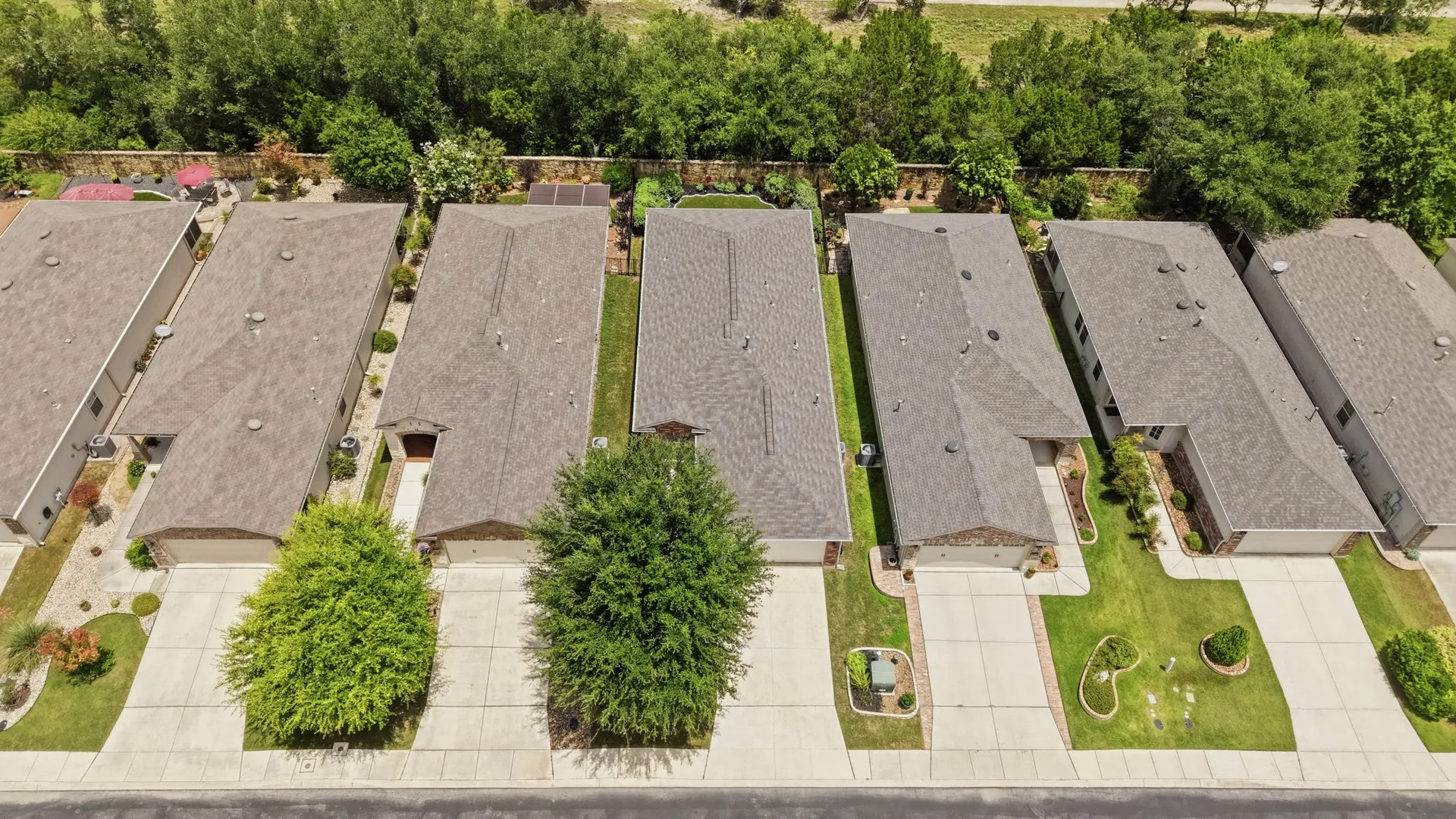 Drone view of the residential street around 12827 Sand Holly in Alamo Ranch