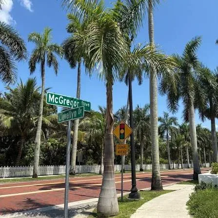 The McGregor Boulevard and Llewellyn Drive corner, palm trees lining the brick-paved road in Fort Myers