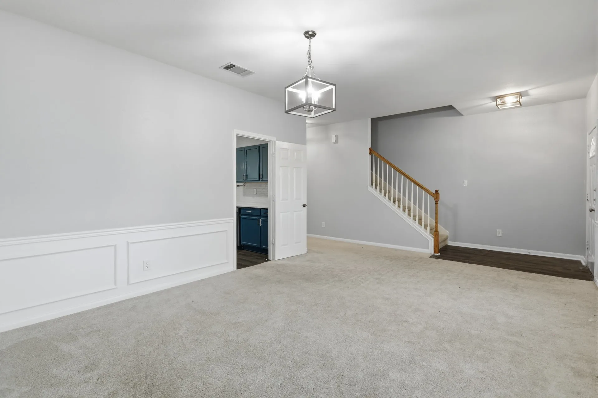 Living room toward the entry and stairs