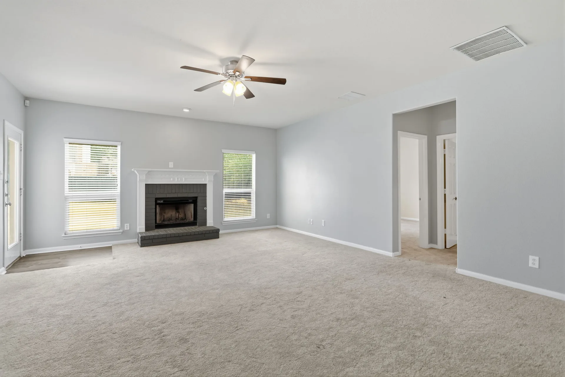 Family room with a wood-burning fireplace