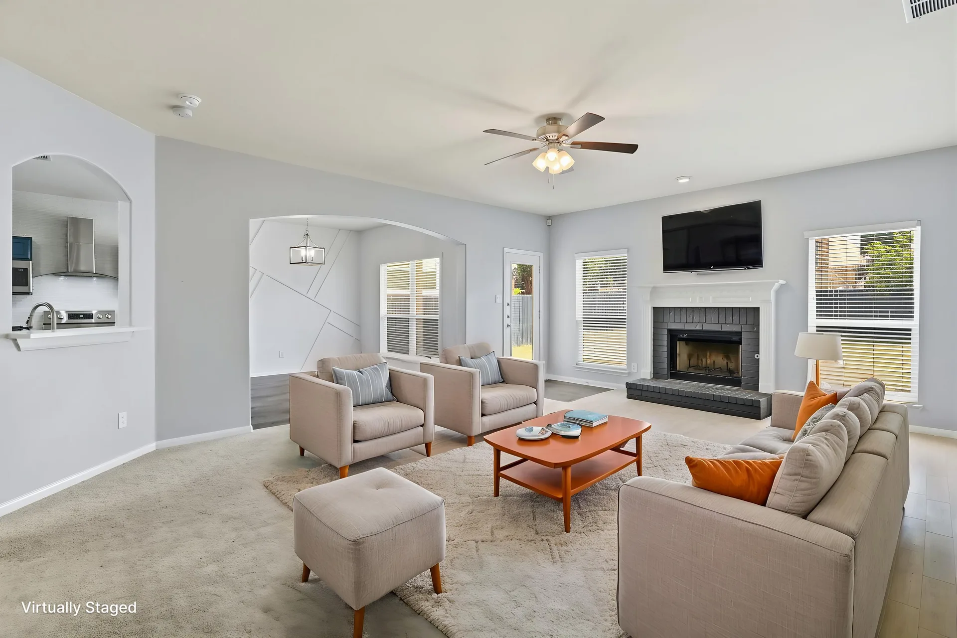 Living room fireplace, styled seating view