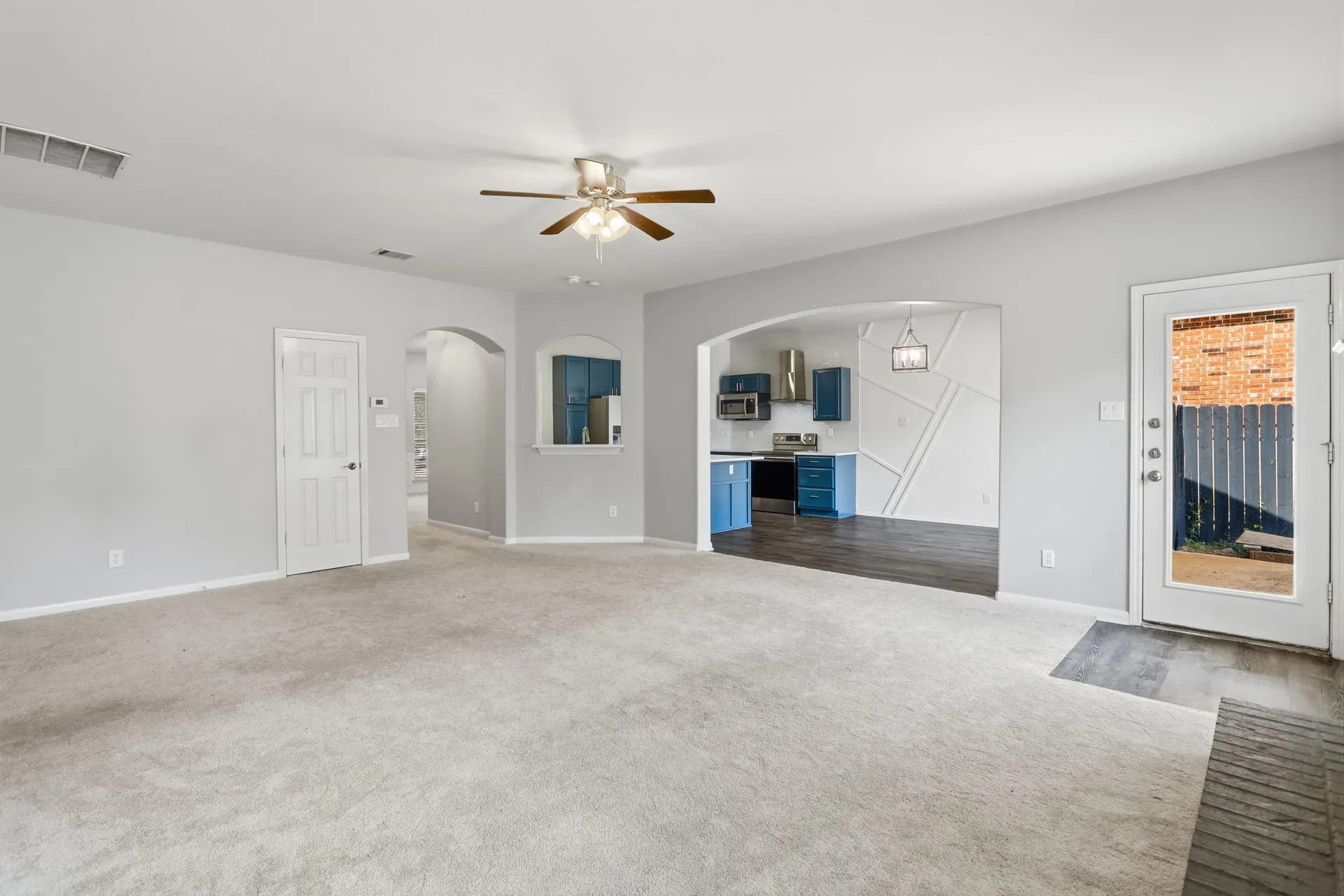 Living room with arched entry