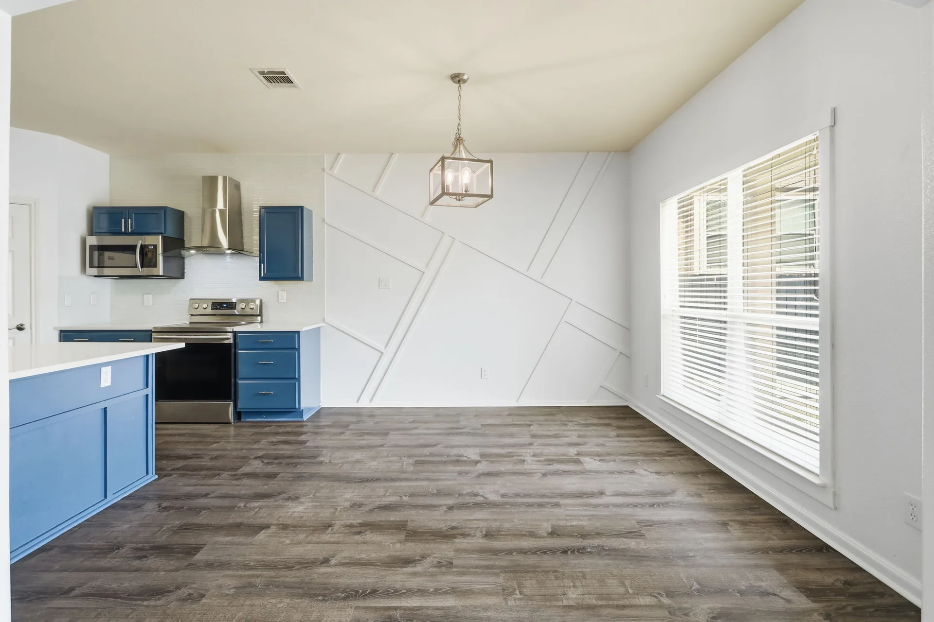 Kitchen and dining with paneled wall