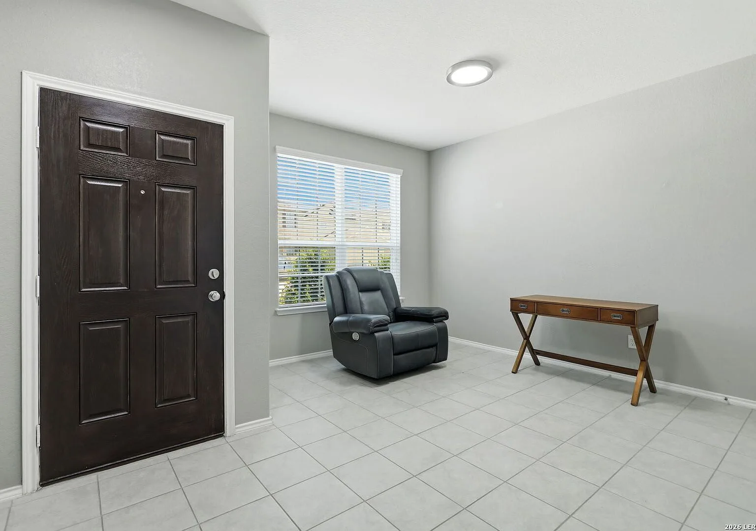 Front flex room with recessed lighting and a window with blinds.