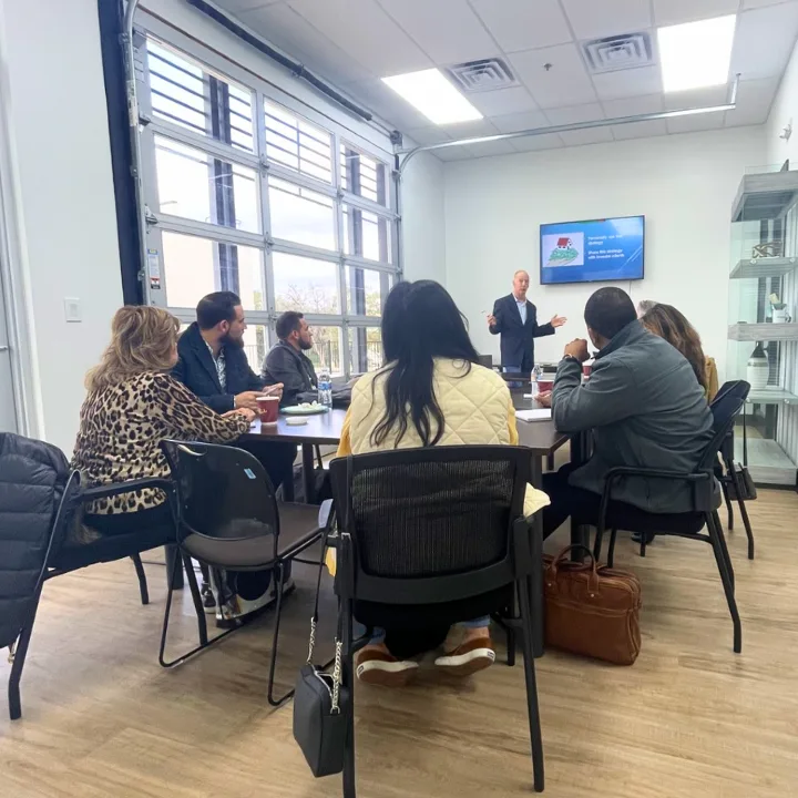 Office meeting room where Patrick reviews financing and loan options with buyers face to face