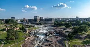 Aerial view of Falls Park with the Big Sioux River waterfalls and downtown Sioux Falls