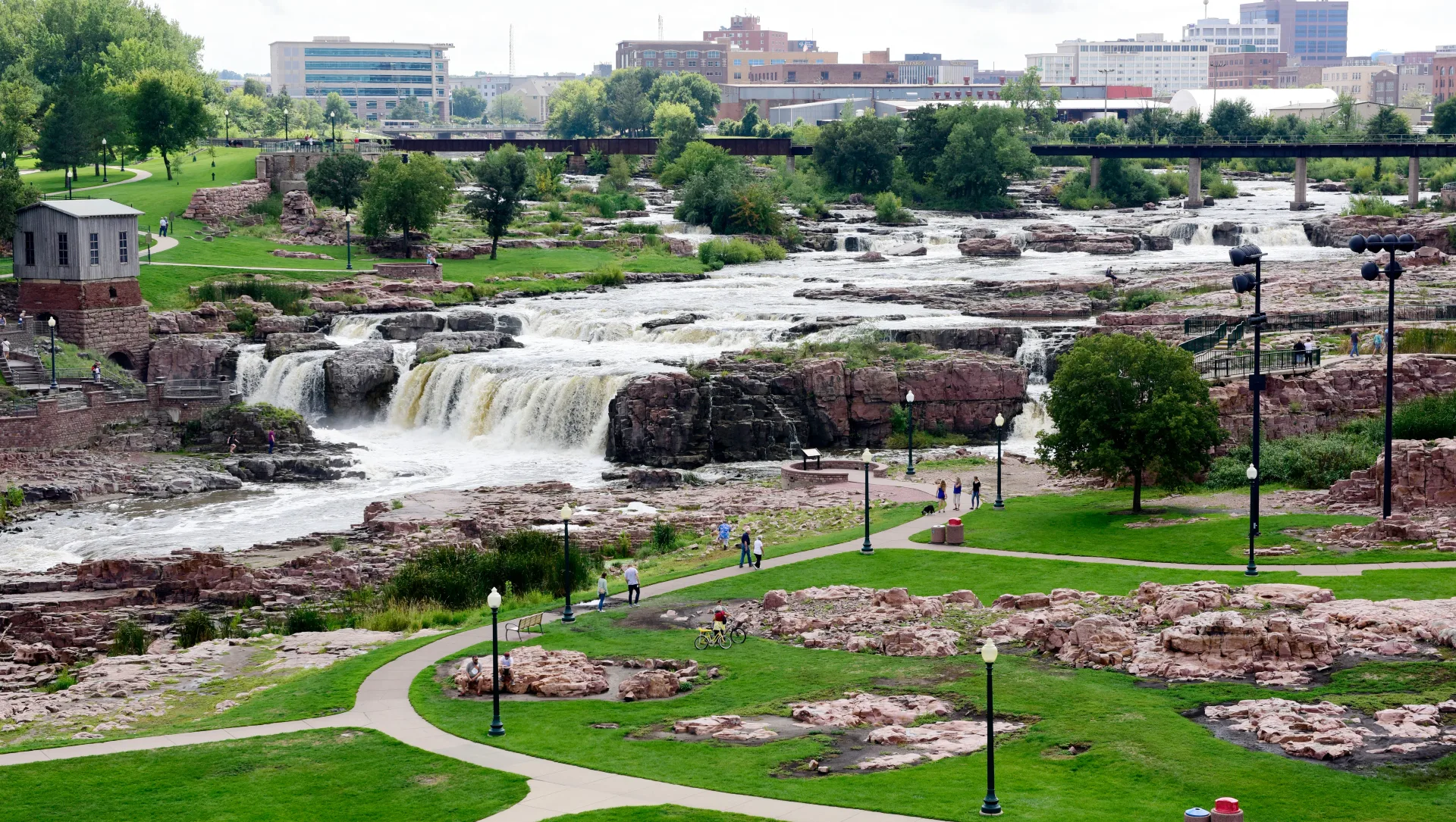 Overlook view of Falls Park with walking paths, lawns, and the Big Sioux River below