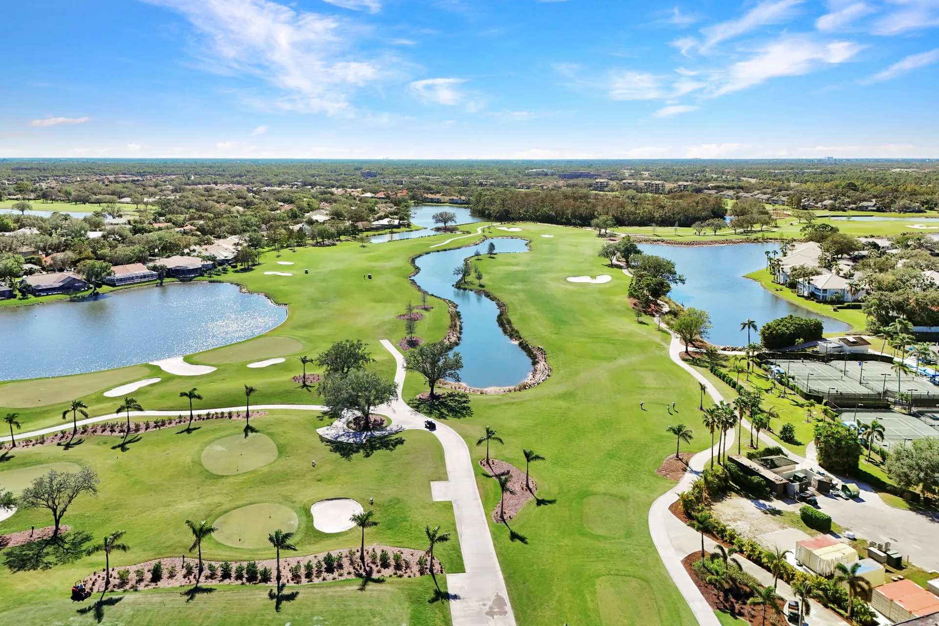 Aerial view of The Vineyards fairways surrounded by lakes and mature trees