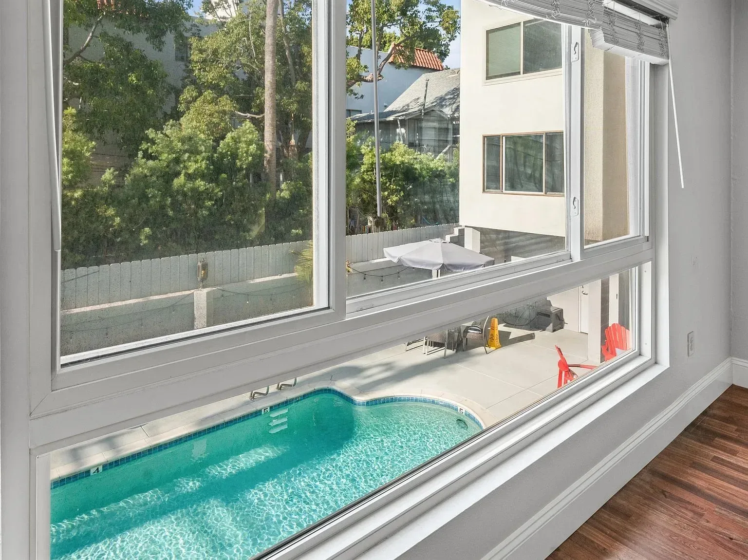 Window view over the community pool from the 140 Walnut Ave unit