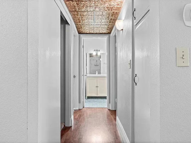 Hallway leading to the full bathroom at 140 Walnut Ave, Unit 2F