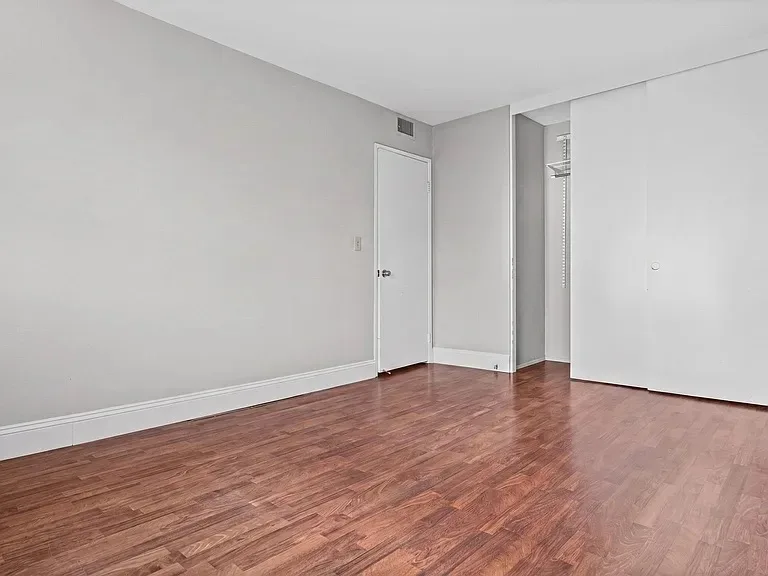 Empty bedroom interior at 140 Walnut Ave, Unit 2F