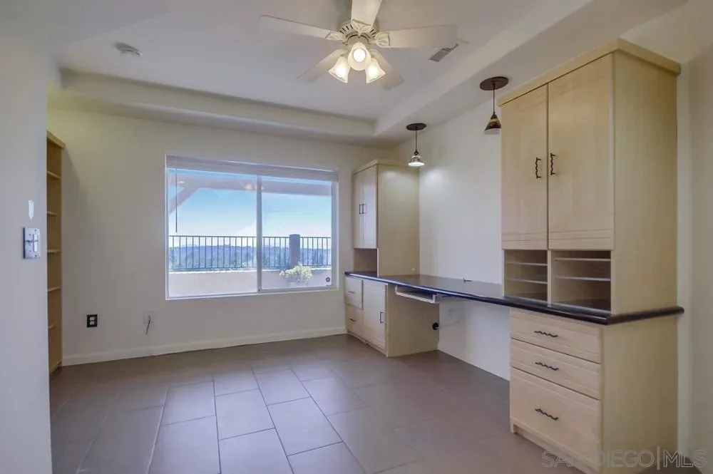 Home office with custom built-in cabinetry at 2703 Lobelia Road
