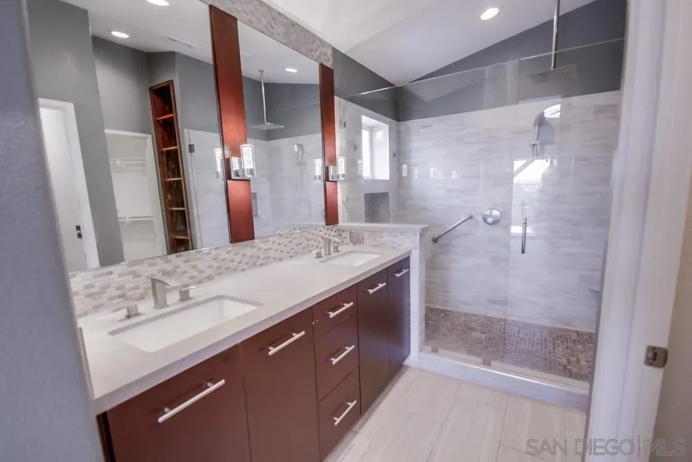 Modern bathroom with double vanity at 2703 Lobelia Road