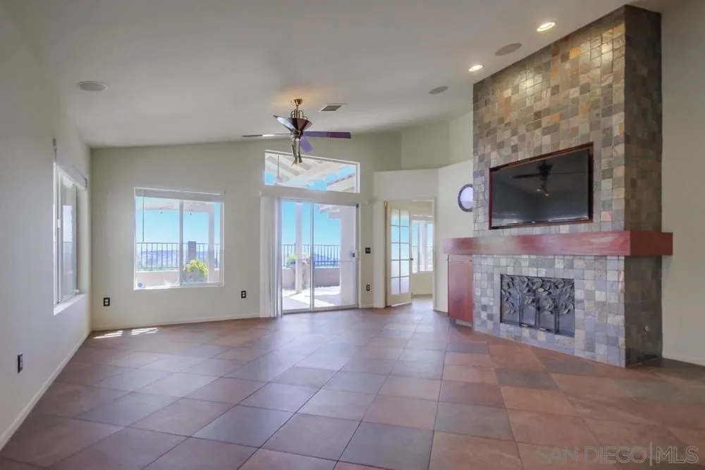 Living room with stone fireplace at 2703 Lobelia Road in Alpine