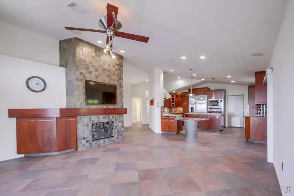 Open-concept living room and kitchen at 2703 Lobelia Road