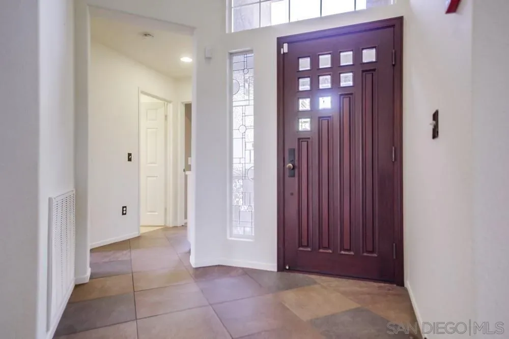 Entryway with custom front door at 2703 Lobelia Road