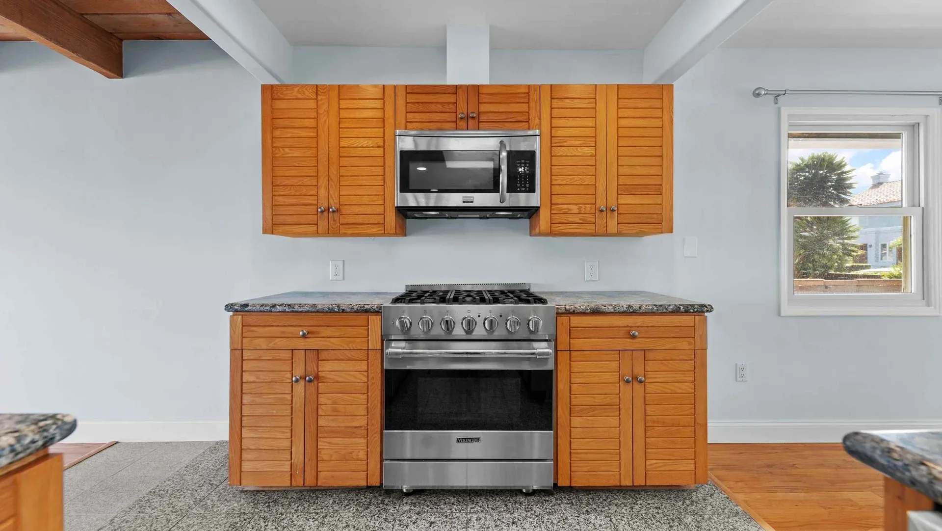 Kitchen with wood cabinets and a stainless steel range at 425 Neptune Ave
