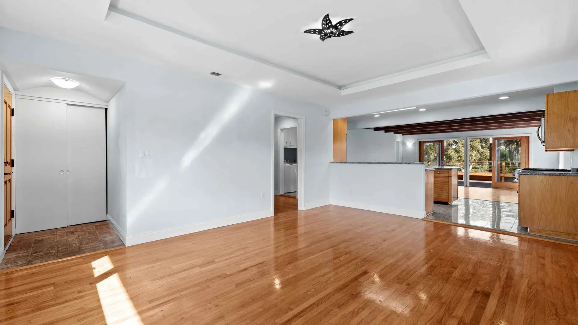 Open living and dining area with hardwood floors at 425 Neptune Ave