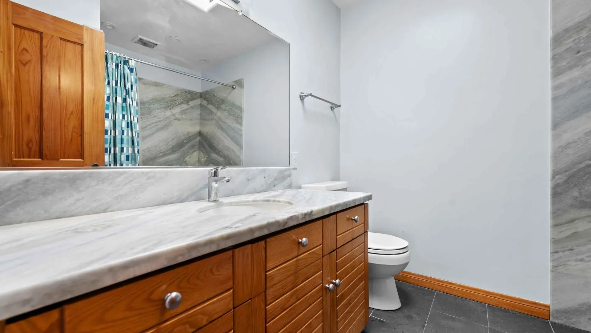Bathroom vanity with a marble countertop at 425 Neptune Ave