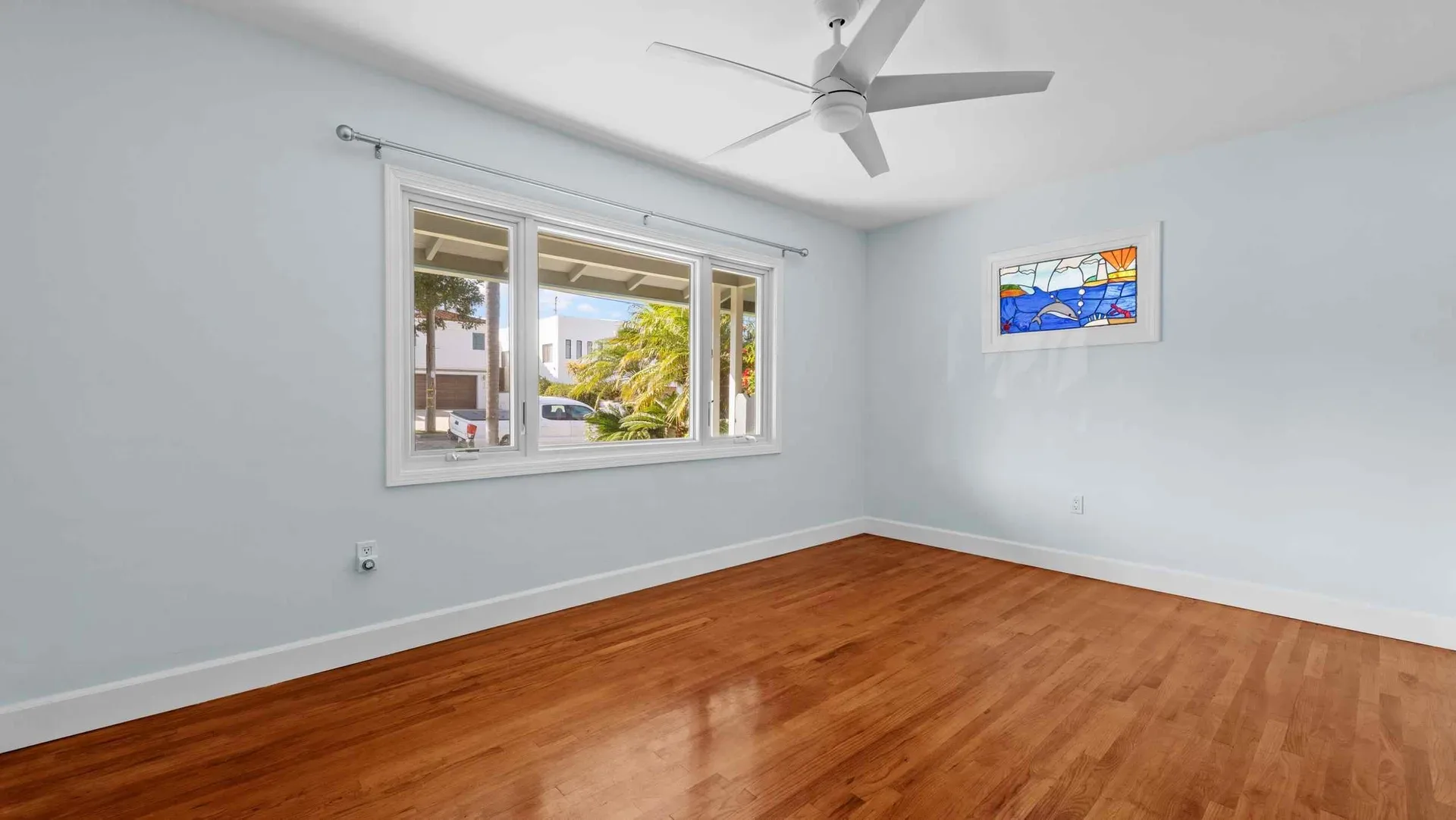 Bright bedroom with hardwood floors at 425 Neptune Ave