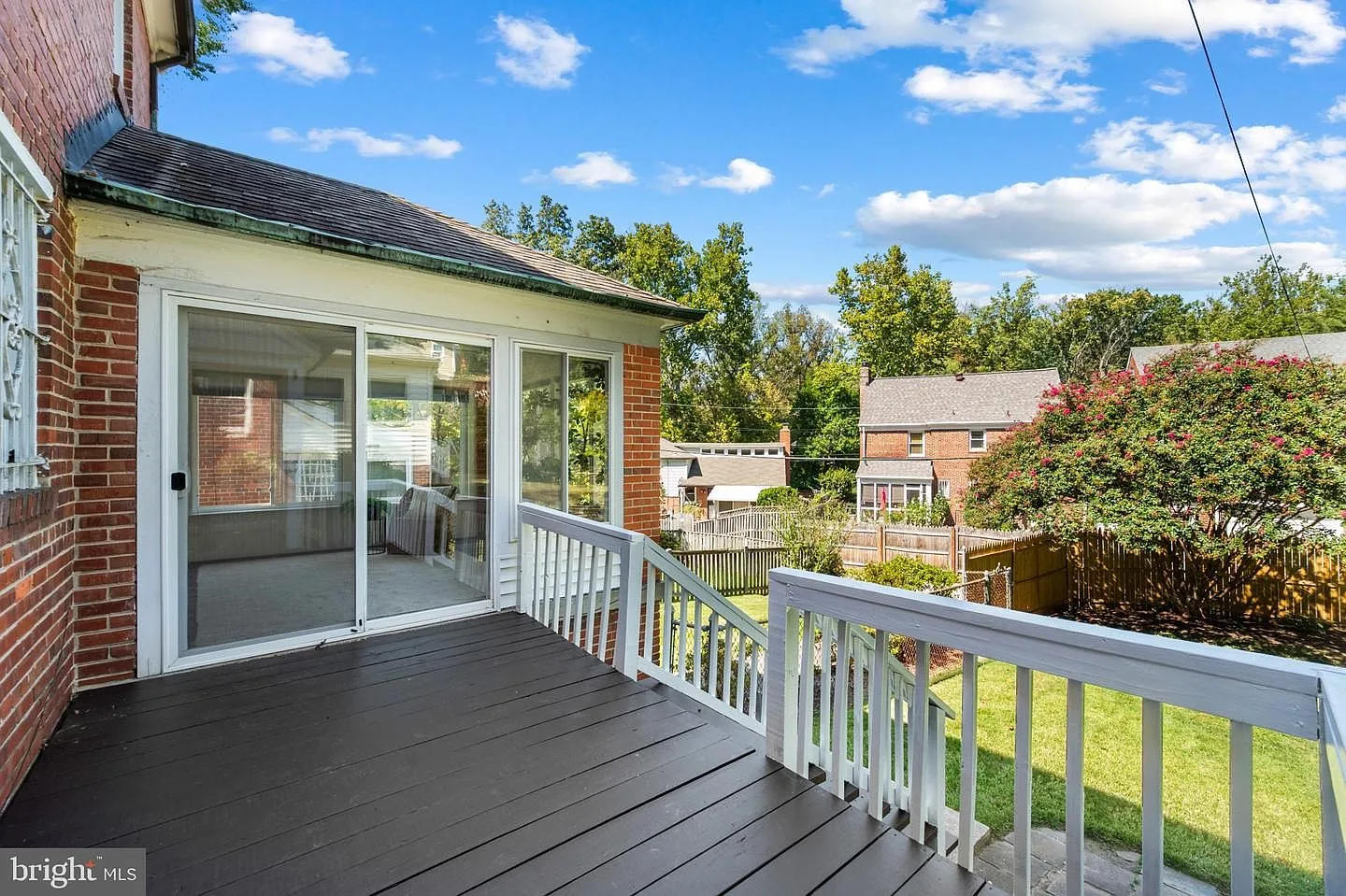 Wooden backyard deck off the rear of the house