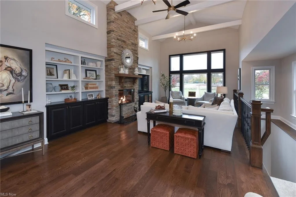 Living room with stone fireplace at 1904 Wynwood Dr