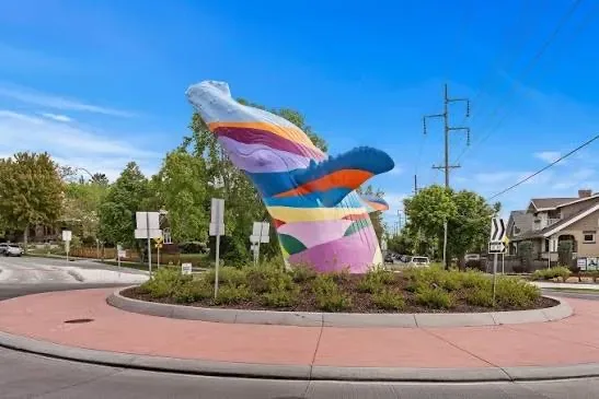 The whale sculpture roundabout at the edge of the 9th and 9th district, park artwork in the center of the traffic circle