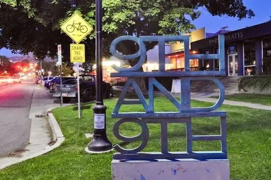 The neighborhood landmark sign welcoming visitors to the 9th and 9th district