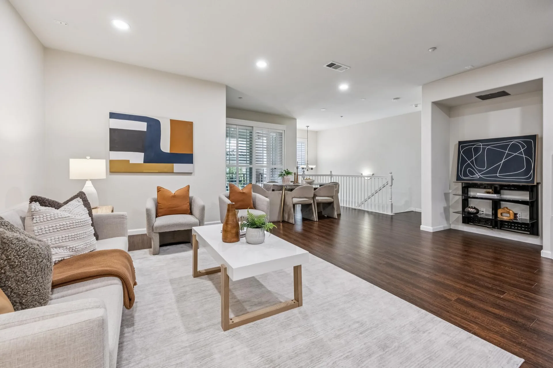 Living room looking toward the dining area with hardwood flooring