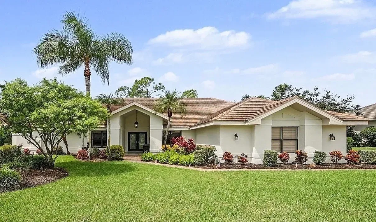 Front exterior and curb appeal of 20248 Puma Trail in Wildcat Run, Estero, FL